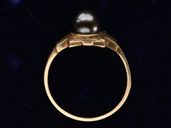 thumbnail of c1920 Art Deco black pearl ring in yellow gold (side profile shown on dark purple background)