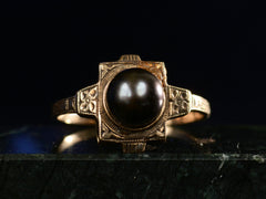 thumbnail of c1920 Art Deco black pearl ring in yellow gold (front view on dark background)