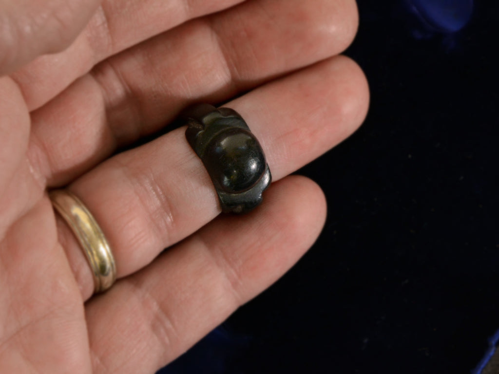 Front view of c1880 Black Bog Oak Ring (on hand for scale)