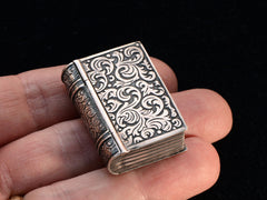 thumbnail of c1900 Ornate Book Box (on hand for scale, showing front cover)