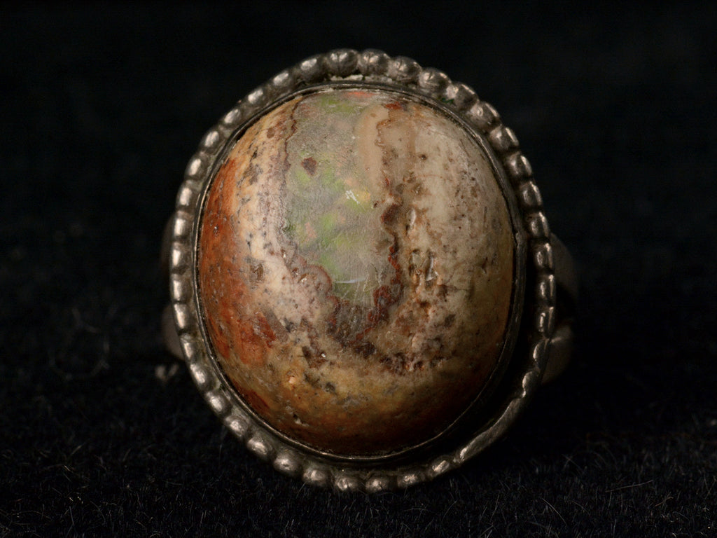 Vintage Boulder Opal Ring in Silver, front view on black background