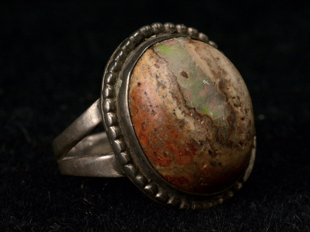 Vintage Boulder Opal Ring in Silver, left angle on black background