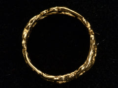 thumbnail of Side profile view of wide brutalist wedding band in 18k yellow gold, shown on black background.