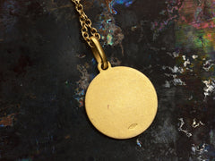 thumbnail of Reverse side of round gold pendant showing Italian "750" stamp for 18K gold.