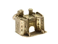 thumbnail of Front angled view of castle charm in gold, on white background.