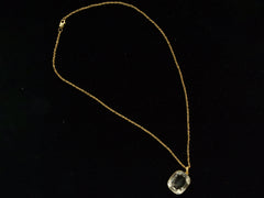 thumbnail of A c1820 Georgian era gold and crystal intaglio pendant and chain. Shown on black background.