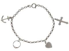 thumbnail of c1930 Vintage Silver Charm Bracelet with 4 Charms: an Anchor, a Baby Ring, a Heart, and a Cross. Shown on white background.