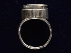 thumbnail of Side profile of c1900 Silver and Enamel Cherub Ring (on dark blue background)