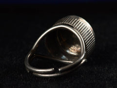 thumbnail of Reverse view of c1900 Silver and Enamel Cherub Ring (on dark background)