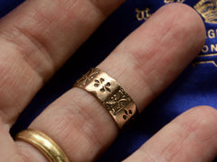 thumbnail of A patterned 12K rose gold Victorian band, shown on finger.