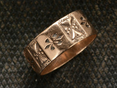 thumbnail of Angled view of patterned 12K rose gold Victorian band, shown on dark textured background.
