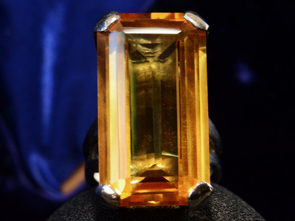 Front view of c1970 Orange Citrine and Silver Cocktail Ring (on dark blue background)