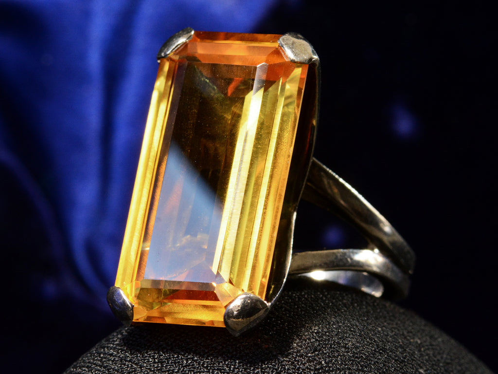 Right angle view of c1970 Orange Citrine and Silver Cocktail Ring (on dark background)