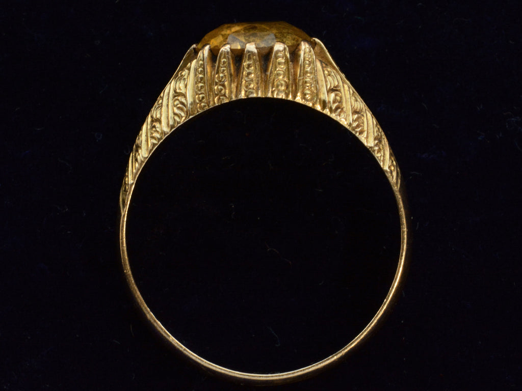 Side profile view of c1940 Portuguese Citrine Ring in Yellow Gold (shown on dark blue background)