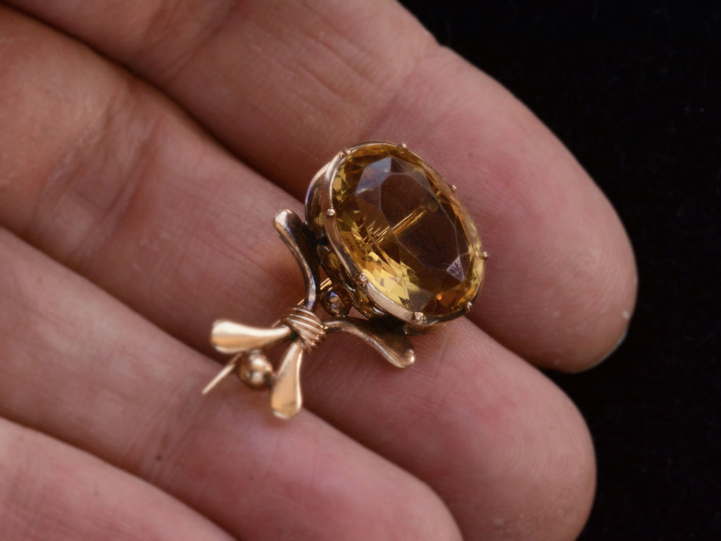 c1835 Citrine Comet Pin (on hand for scale)
