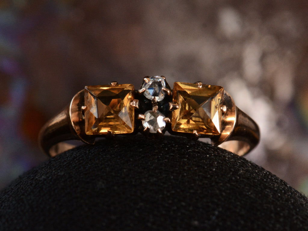 Front view of c1900 Citrine & Diamond Ring in Rosy-Yellow Gold (shown on dark background)