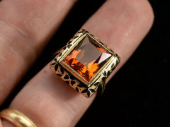 thumbnail of c1930 Art Deco Orange Citrine Ring with Black Enamel Decoration on Yellow Gold (Shown on finger)