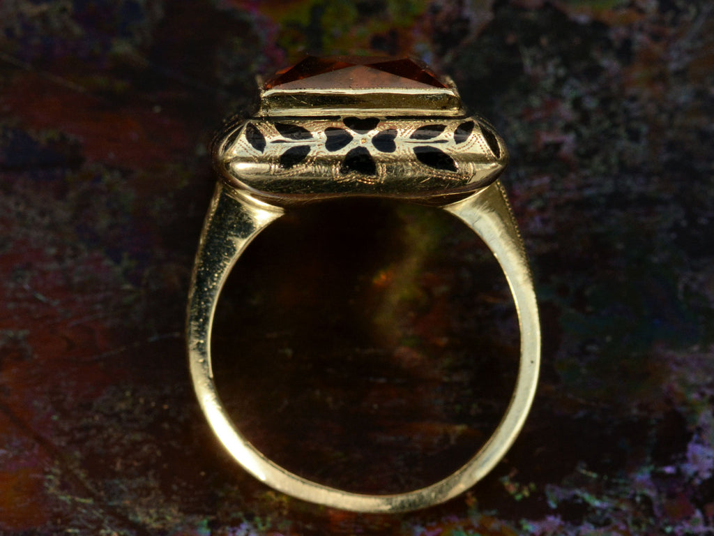 Side profile of c1930 Art Deco Orange Citrine Ring with Black Enamel Decoration on Yellow Gold (Shown on dark background)