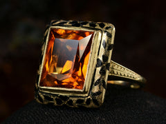 thumbnail of Right angled view of c1930 Art Deco Orange Citrine Ring with Black Enamel Decoration on Yellow Gold (Shown on dark background)