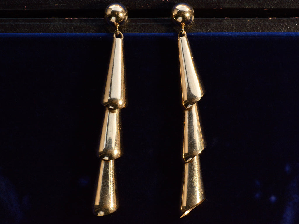 c1980 Articulated Gold Earrings (on dark blue background)