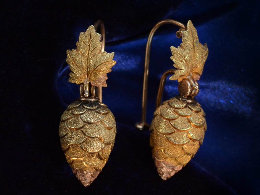 Angled view of c1880 Victorian Gold Berry Earrings (on dark blue background)