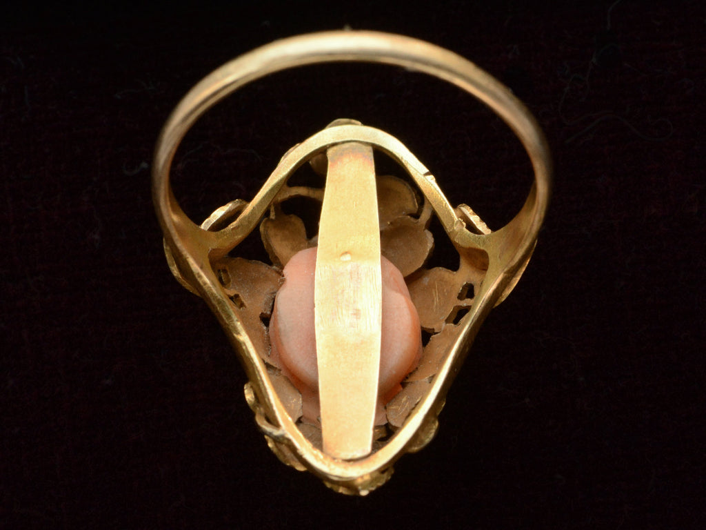 Inside view of 1930 ring with a coral rose shown on black background.