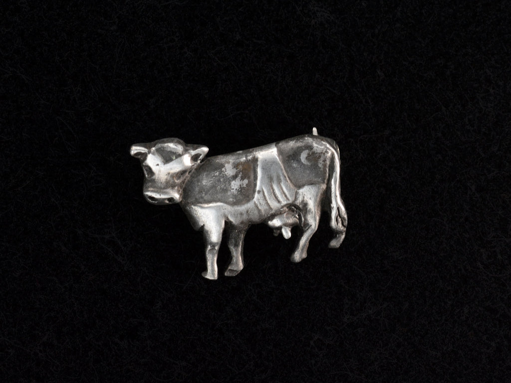 c1980 Tiny Silver Cow Brooch (on black background)