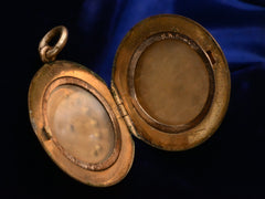 thumbnail of c1900 Rose Gold Filled Crescent Locket with Red and White Paste (shown open on black background)