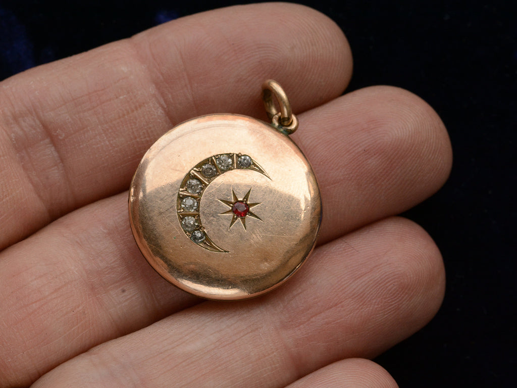 c1900 Rose Gold Filled Crescent Locket with Red and White Paste (shown on hand for scale)