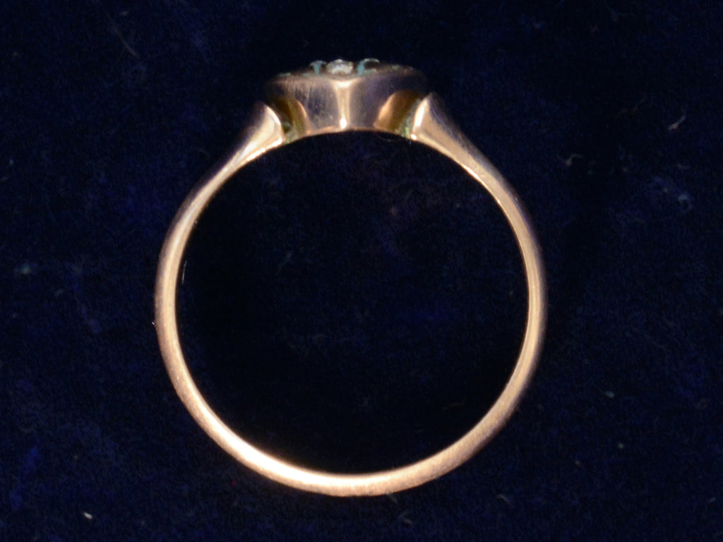 Side profile of c1890 Diamond Cross Ring in Rose Gold (shown on dark blue background)