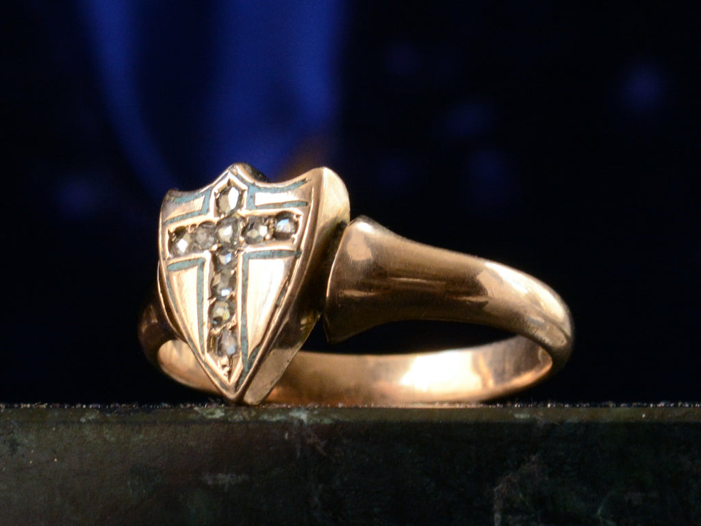 Right angle view of c1890 Diamond Cross Ring in Rose Gold (shown on dark blue background)