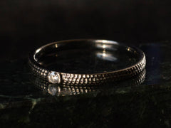 thumbnail of Left angle view of De Beers Talisman Blacked Gold Diamond Band (shown on dark background)