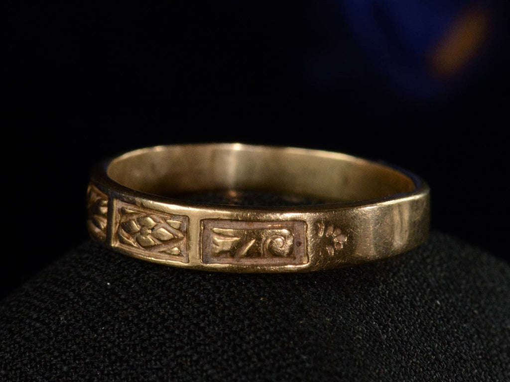 Right angled view of c1890 Patterned Yellow Gold Band (on black background)