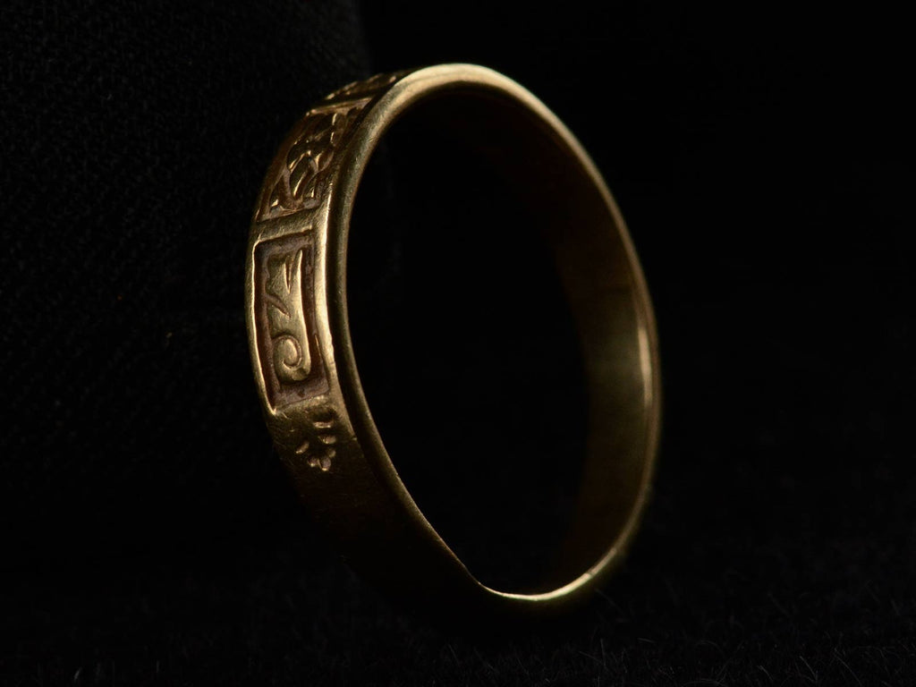 Angled profile view of c1890 Patterned Yellow Gold Band (on black background)