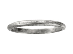 thumbnail of An antique platinum wedding band with engraved patterning, shown on white background.