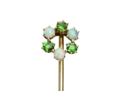thumbnail of Detail of an antique yellow gold Victorian stick pin with three opals and three vivid green demantoid garnets arranged in a circle. Shown on white background.