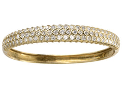 thumbnail of A vintage 18K yellow gold bracelet set with three rows of round white diamonds in a fish-scale like pattern, shown on white background.
