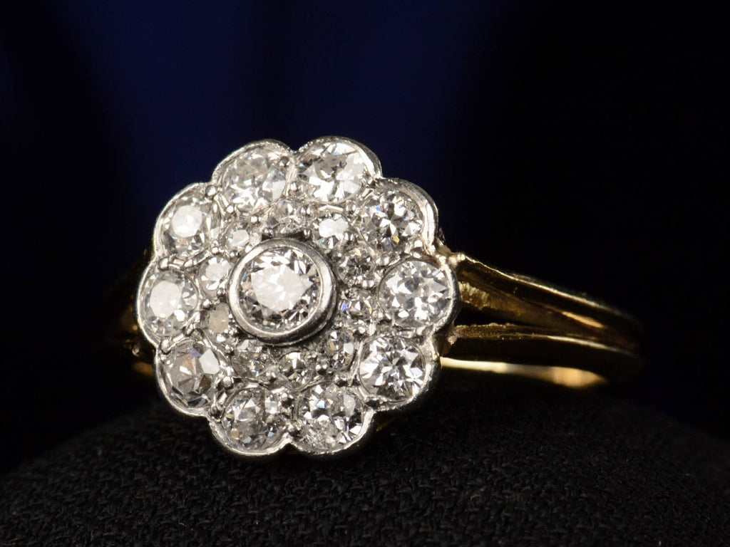 Right angle view of c1920 Diamond Cluster Ring, 18K Yellow Gold and Platinum (shown on black background)