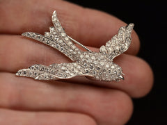 thumbnail of Vintage c1950 diamond-studded bird-shaped brooch on hand