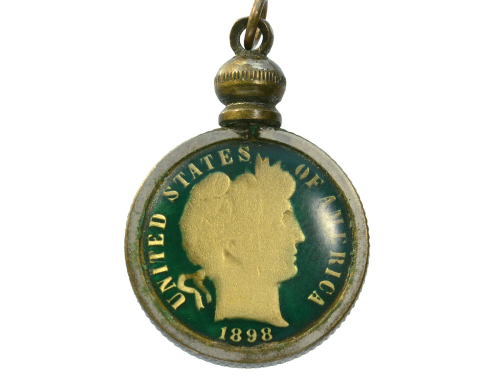 Pendant with gilt and green enamel dime mounted in brass, shown on white background. The words "United States of America 1898" are visible on the dime.
