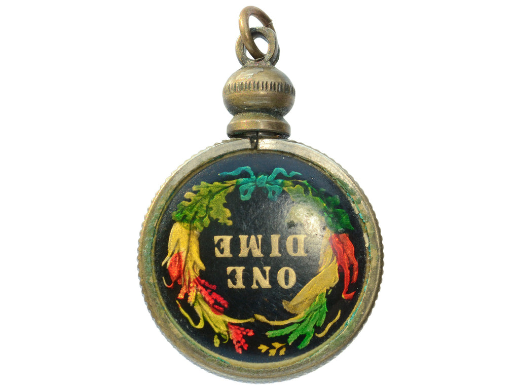 Opposite side of pendant with gilt and colorful enamel dime mounted in brass, shown on white background. The words "One Dime" are visible on the dime.