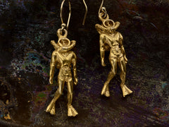 thumbnail of Pair of gold scuba diver earrings, on dark iridescent background.