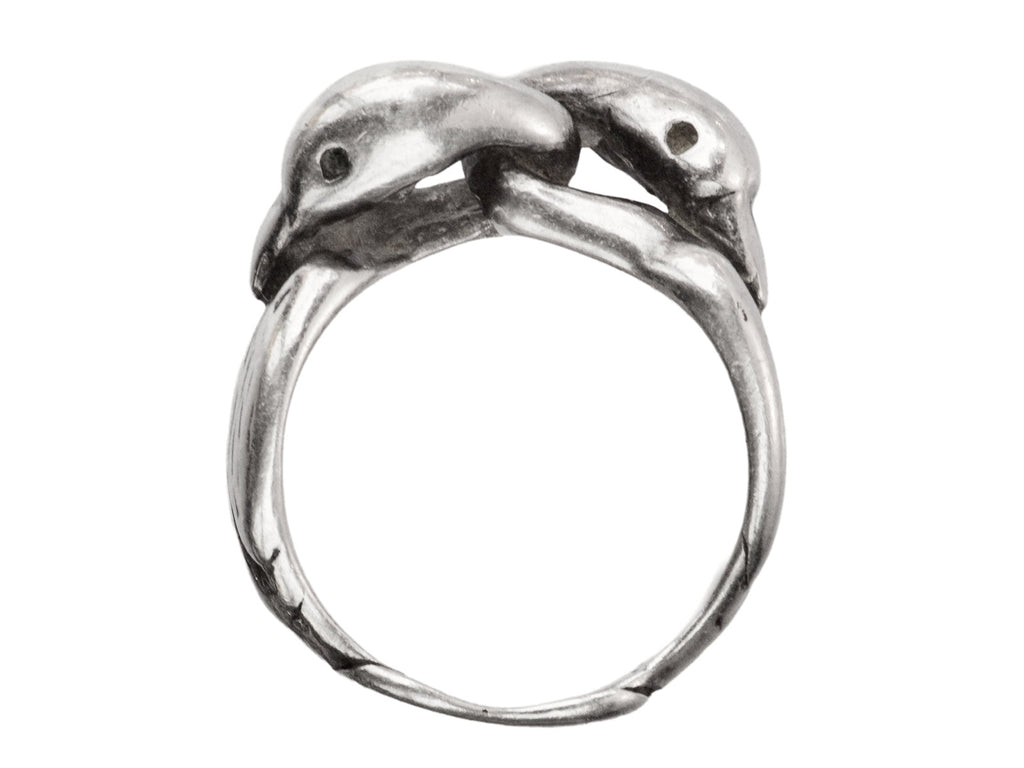 Side profile of sterling silver double swan head ring, on white background.