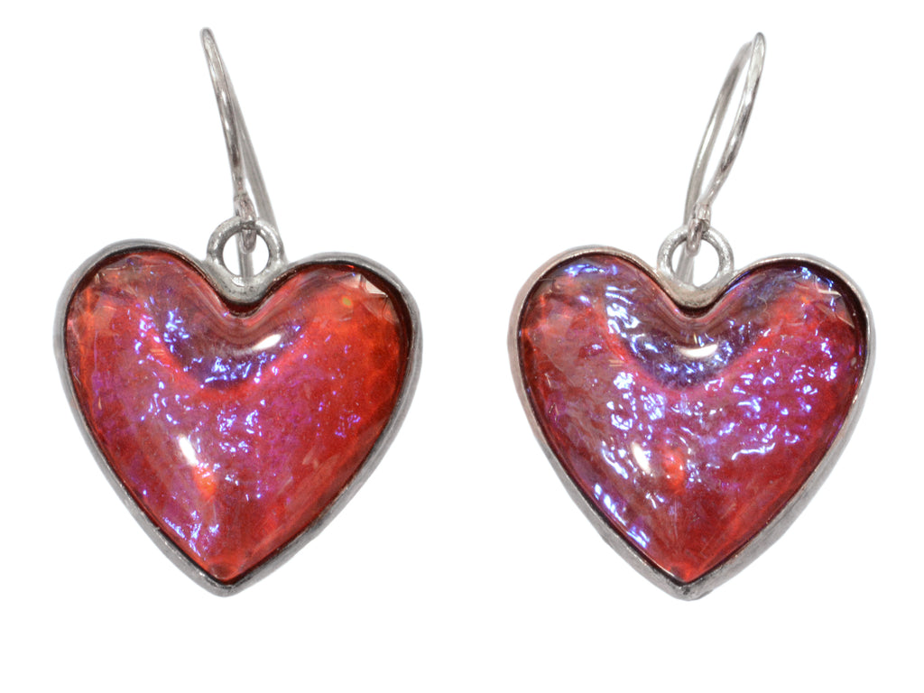 c1950 heart shaped earrings with iridescent red glass set in silver (shown on white background)