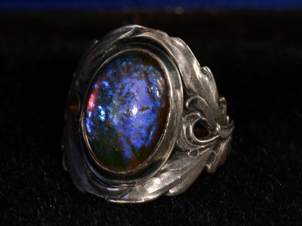 Right side view of c1910 Dragon's Breath Ring (showing purple iridescence)