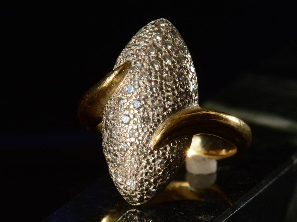 Left angle view of c1990 Diamond Egg Ring (shown on dark background)