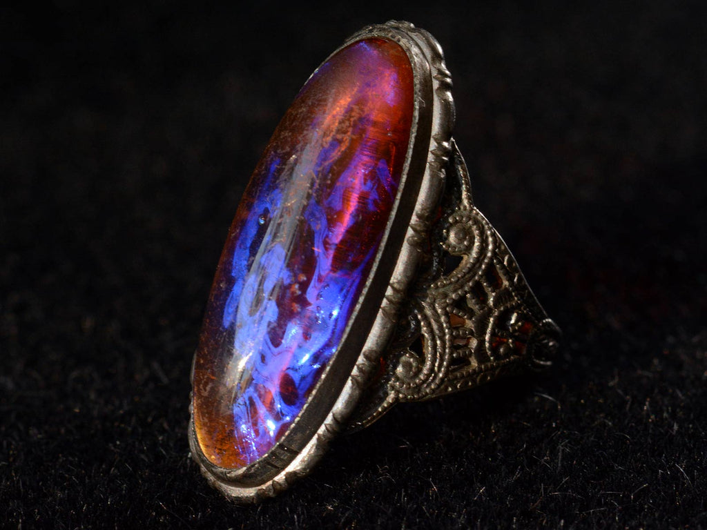 Right angle view of c1920 Dragon's Breath Ring in Silver (on black background)