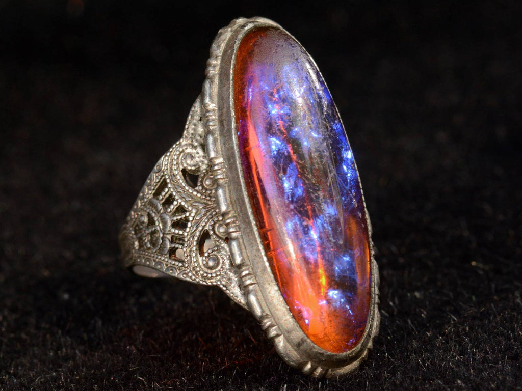 Left angle view of c1920 Dragon's Breath Ring in Silver (on black background)