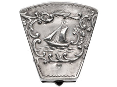 thumbnail of An antique silver wedge-shaped c1920 Dutch pillbox with the image of a sailboat, shown on white background.