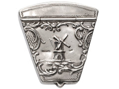 thumbnail of An antique silver wedge-shaped c1920 Dutch pillbox with the image of a windmill, shown on white background. A "HOLLAND" stamp is visible. 